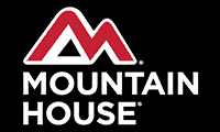 mh-logo Cozy mountain harbor cabin surrounded by lush greenery and scenic mountain views.